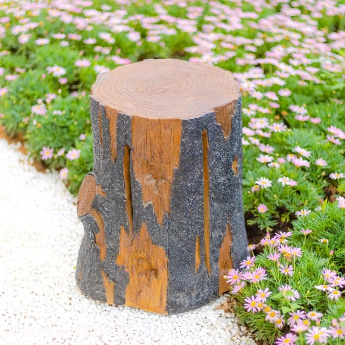 luminous tree stump light — lantern daytime
