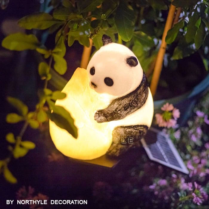 Decorative garden light sculptures in public park walkway — commercial outdoor lighting by Northyle