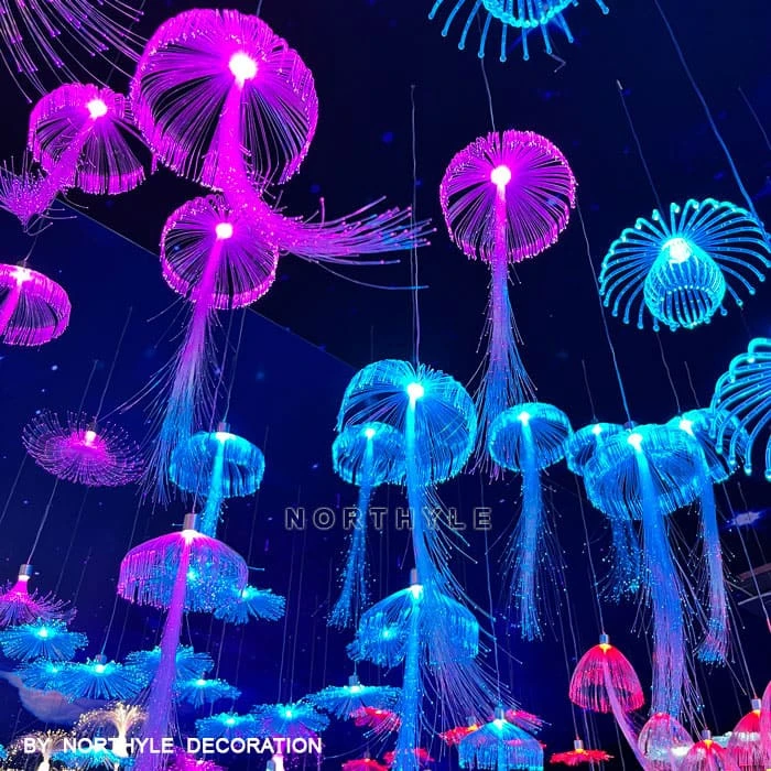 Fiber optic jellyfish lighting installation for immersive outdoor venue — fantasy landscape lighting by Northyle